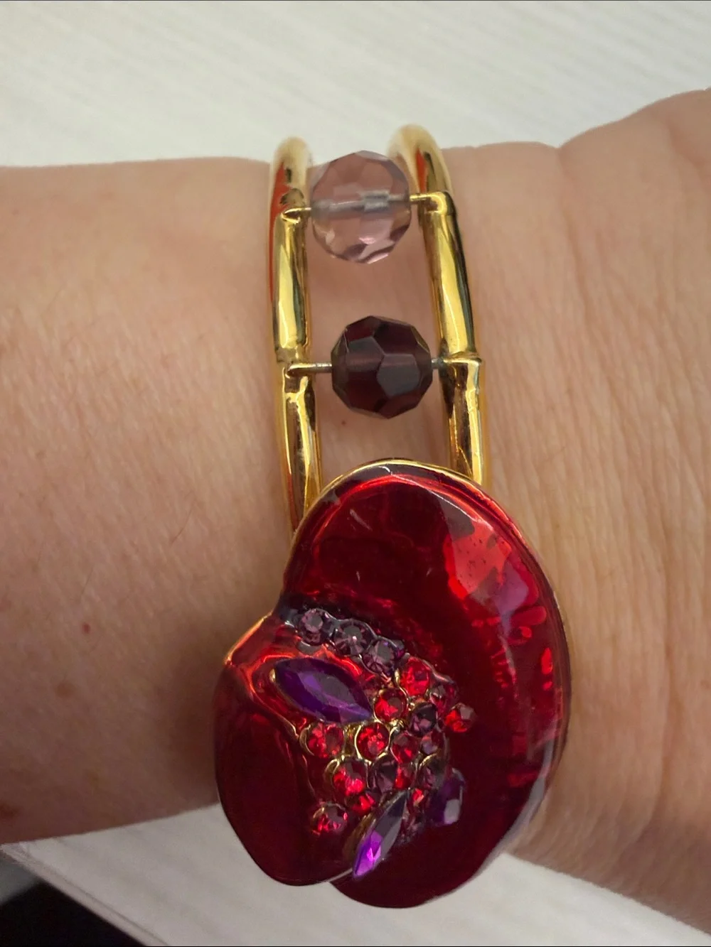 Gold Bangle Bracelet with Red Floral Accent